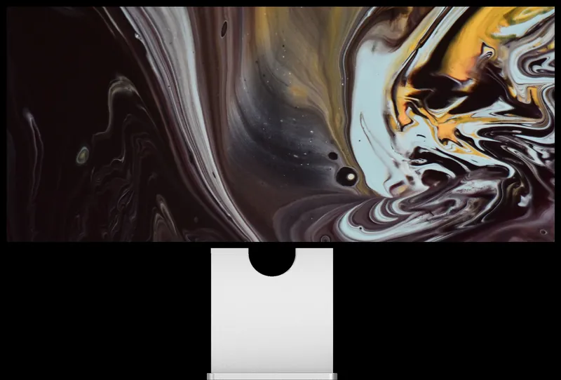 Écran Kuycon W34KB sur fond noir affichant un marbré sombre, noir, gris et or, pour illustrer le contraste
