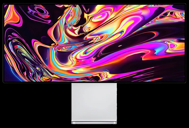 Écran Kuycon W34KB sur fond noir affichant des volutes rose, orange, jaune et bleu très saturées, pour illustrer la richesse des couleurs